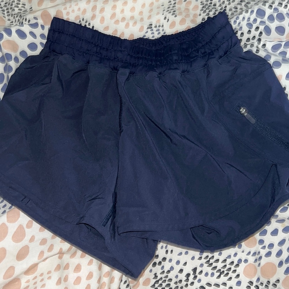 Track that high-rise lined Lululemon 3 inch shorts in navy.
